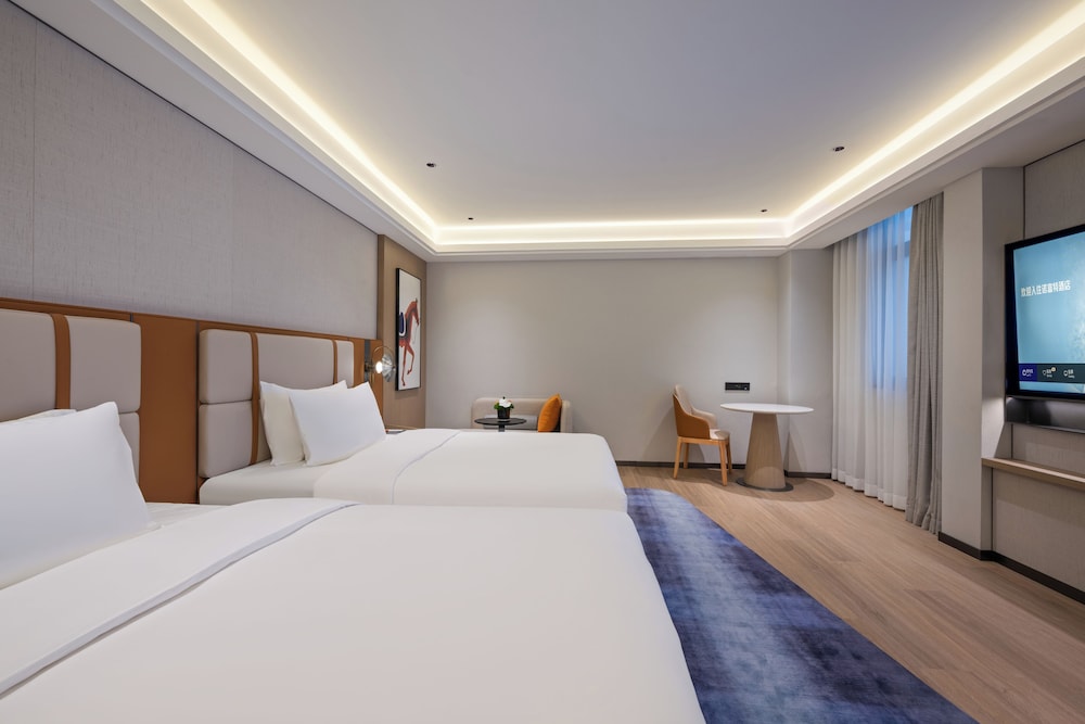 Habitación Deluxe con dos camas individuales del hotel Novotel Shanghai Hongqiao International Airport. Foto 3