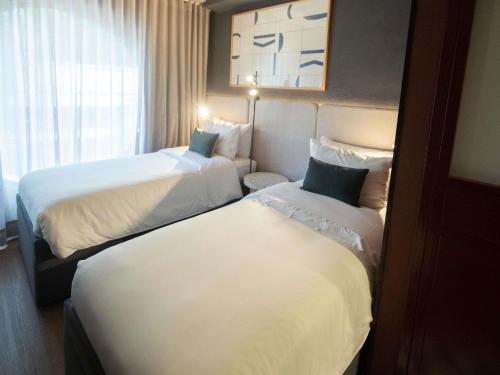 Habitación Xs Tribe Essential doble con 2 camas del hotel Tribe Medellín