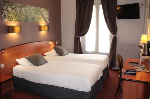 Habitación Twin (2 camas individuales) del hotel Kyriad Paris 13 - Italie Gobelins