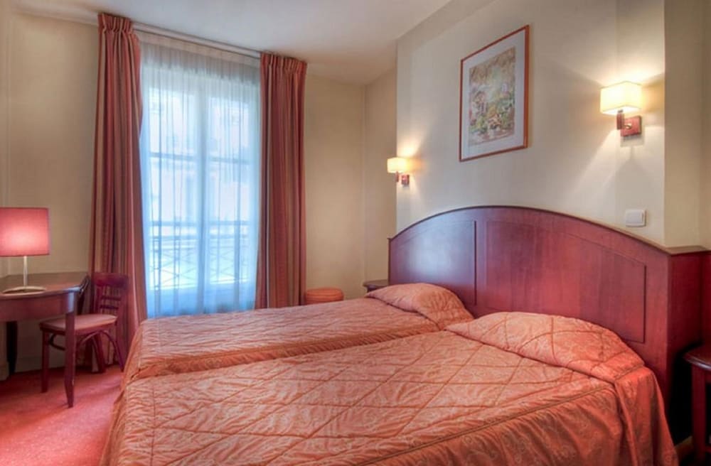 Habitación con 2 camas individuales del hotel Le Faubourg