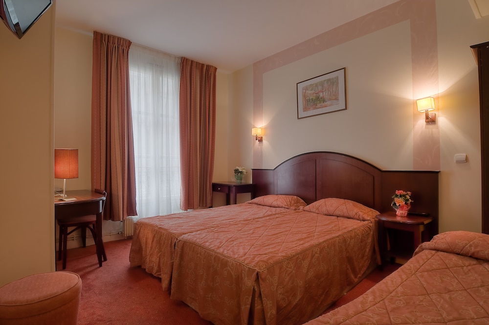 Habitación Triple del hotel Le Faubourg. Foto 3