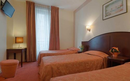 Habitación Triple del hotel Le Faubourg. Foto 3