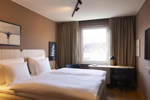 Habitación Estándar - Cama extragrande del hotel Scandic Stuttgart Europaviertel. Foto 1