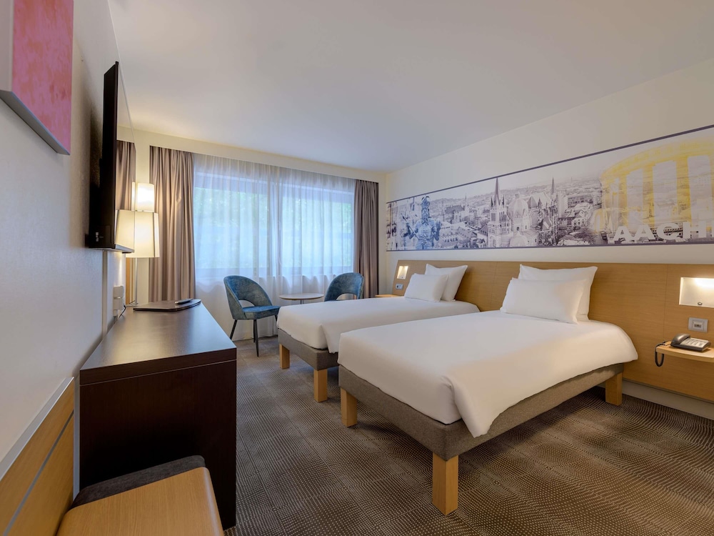 Habitación estándar con camas individuales del hotel Novotel Aachen City. Foto 1