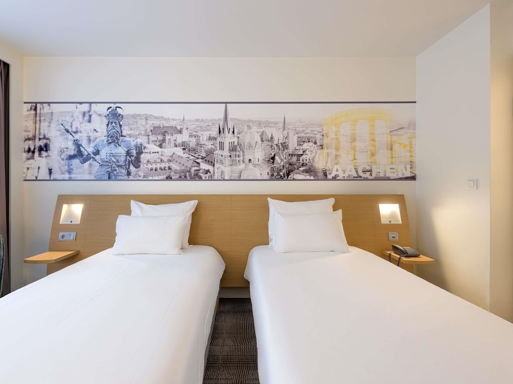 Habitación estándar con camas individuales del hotel Novotel Aachen City. Foto 8