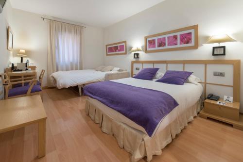 Habitación Triple del hotel Itaca Salamanca by Soho Boutique. Foto 1