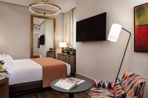 Habitación Superior interior del hotel Nh Collection Madrid Paseo Del Prado. Foto 1