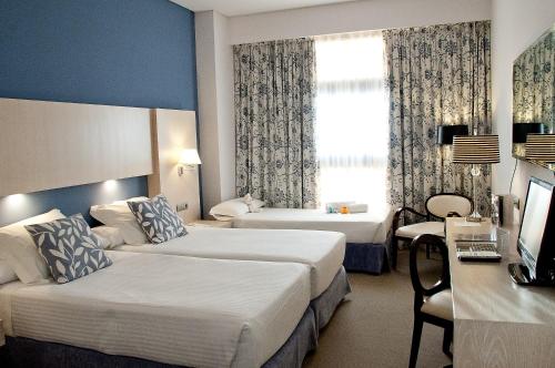 Habitación Triple del hotel Nuevo Boston