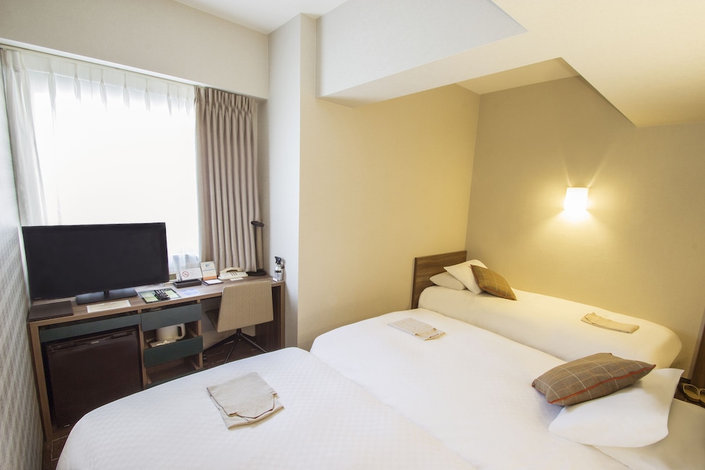 Habitación triple, no fumadores del hotel Hearton Shinsaibashi. Foto 6