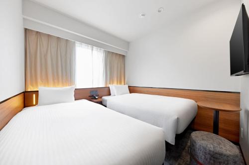Habitación Doble Económica - 2 camas - No fumadores del hotel Sotetsu Grand Fresa Osaka - Namba. Foto 8