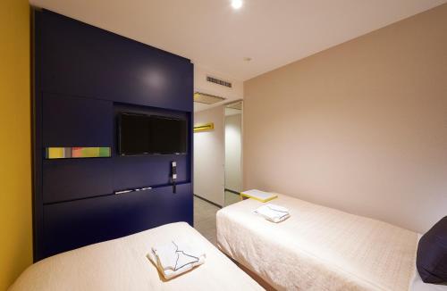 Habitación Doble Económica - 2 camas - No fumadores del hotel Sotetsu Grand Fresa Osaka - Namba. Foto 9