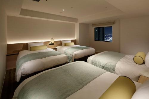 Habitación Cuádruple - No fumadores - Plantas 33 a 37 del hotel Sunshine City Prince. Foto 10