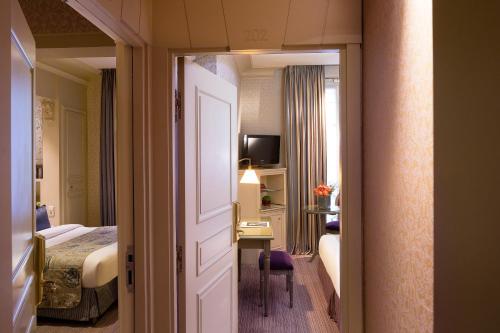 Habitación Cuádruple Clásica del hotel Arioso. Foto 3