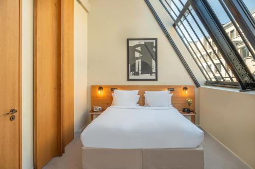 Habitación Executive Deluxe con tragaluz del hotel Maison Honnel. Foto 3