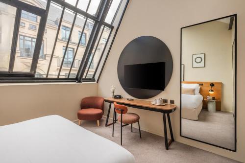 Habitación Executive Deluxe con tragaluz del hotel Maison Honnel. Foto 4