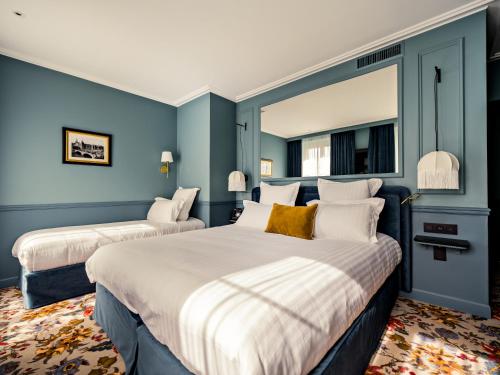 Habitación Triple Superior reformada del hotel Duquesne Eiffel. Foto 7