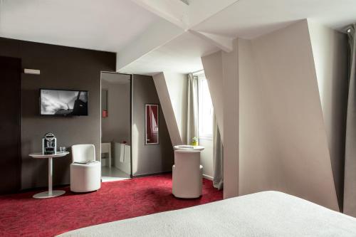 Suite Junior del hotel LE QUARTIER BERCY SQUARE. Foto 3