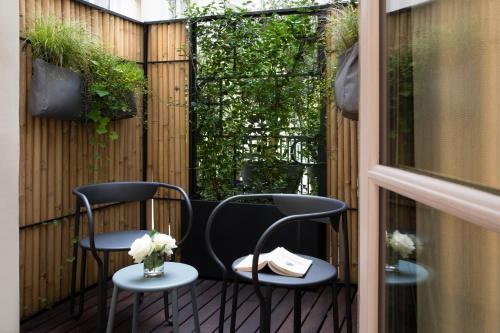 Habitación Doble Deluxe con terraza del hotel R De Paris. Foto 1