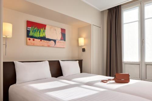 Habitación Doble Confort - 2 camas del hotel Timhotel Odessa Montparnasse. Foto 3