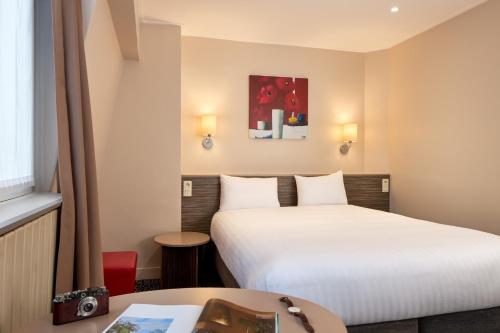 Habitación Familiar del hotel Timhotel Odessa Montparnasse. Foto 1