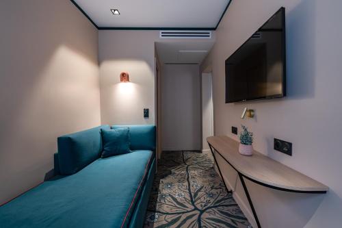 Habitación Triple del hotel O.lysée. Foto 3