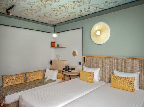 Habitación Triple Executive del hotel Louison. Foto 1
