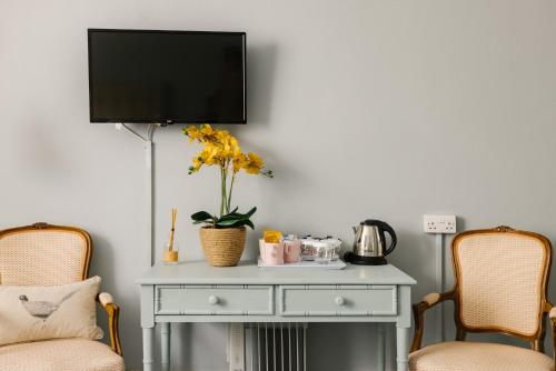 Planta baja - Habitación Familiar Estándar del hotel The Abbey Notting Hill. Foto 3