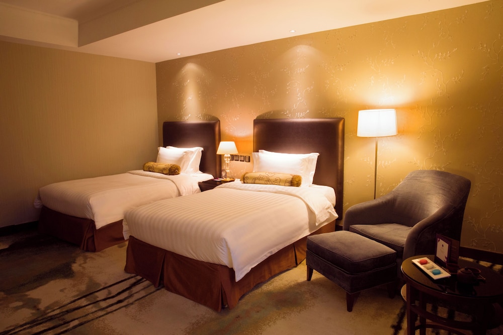 Habitación superior con 2 camas individuales del hotel Grand Mercure Beijing Central. Foto 3