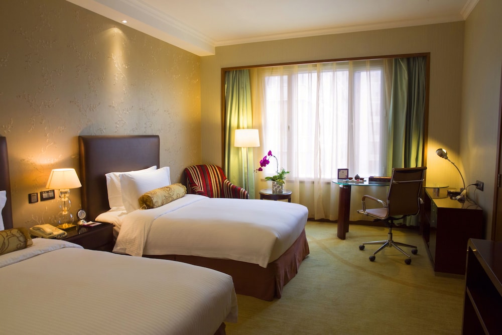Habitación Deluxe con 2 camas individuales del hotel Grand Mercure Beijing Central. Foto 1