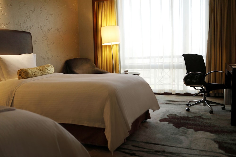 Habitación Deluxe con 2 camas individuales del hotel Grand Mercure Beijing Central. Foto 2