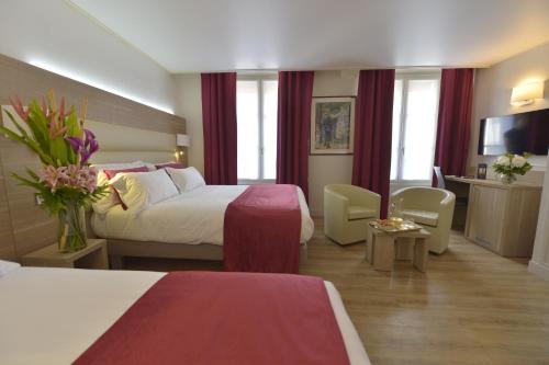 Habitación Triple del hotel Unic Renoir Saint Germain. Foto 1