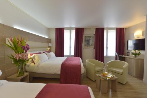 Habitación Cuádruple del hotel Unic Renoir Saint Germain. Foto 2