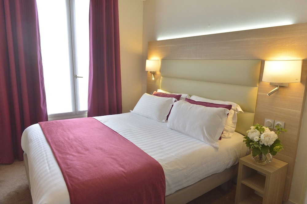 Habitación estándar con 1 cama doble o 2 individuales del hotel Unic Renoir Saint Germain. Foto 1