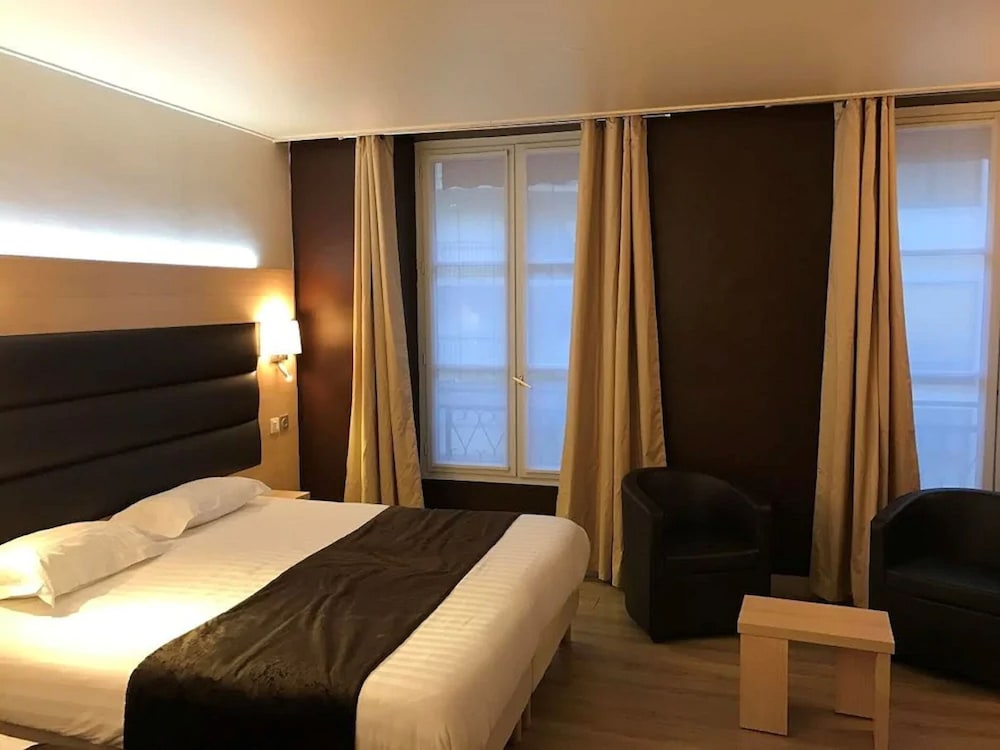 Habitación estándar con 1 cama doble o 2 individuales del hotel Unic Renoir Saint Germain. Foto 2