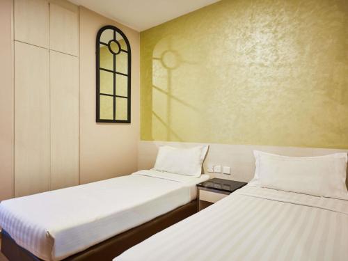 Habitación estándar con 2 camas individuales del hotel Ibis Budget Singapore West Coast (sg Clean). Foto 1