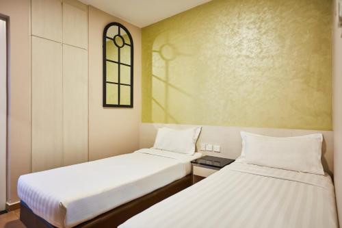Habitación estándar con 2 camas individuales del hotel Ibis Budget Singapore West Coast (sg Clean). Foto 4