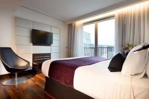 Habitación familiar 1 habitación Vista ciudad Sofá Cama incluido 2 Camas king del hotel Eurostars Grand Central. Foto 4