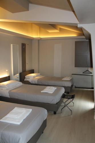 Habitación Triple del hotel Plus Florence. Foto 1