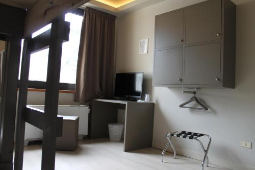 Habitación Triple del hotel Plus Florence. Foto 3