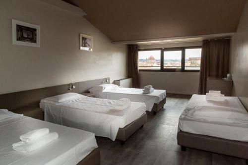 Habitación Cuádruple del hotel Plus Florence. Foto 3