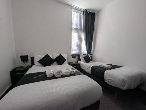 Habitación familiar 1 Cama Individual 1 Cama doble del hotel The Firs Lodge
