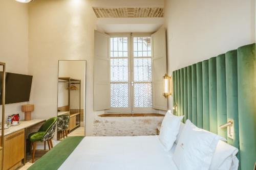 Habitación Doble en la planta baja del hotel Boutique Casas De Santa Cruz. Foto 4