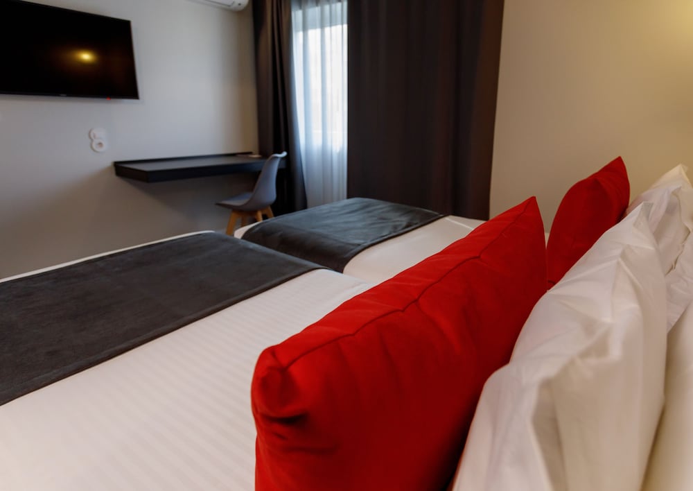 Habitación con 2 camas individuales del hotel Sport Gym + Spa. Foto 6