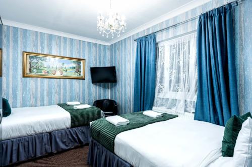 Habitación cuádruple del hotel Lancaster Court