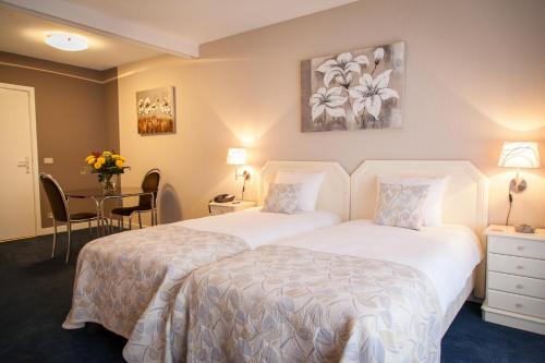 Habitación Doble Clásica - 2 camas del hotel First Euroflat. Foto 3