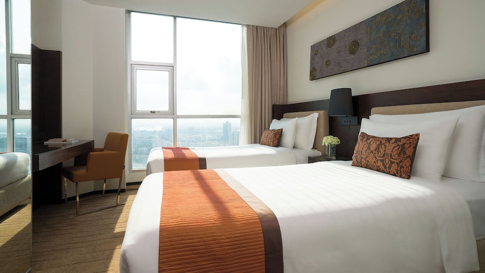 Two Bedroom Suite (with 1 king, 2 single bed) del hotel Jc Kevin Sathorn Bangkok. Foto 2