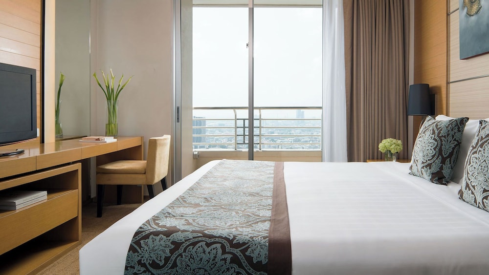 Skyline One Bedroom Suite with Double Bed del hotel Jc Kevin Sathorn Bangkok. Foto 1