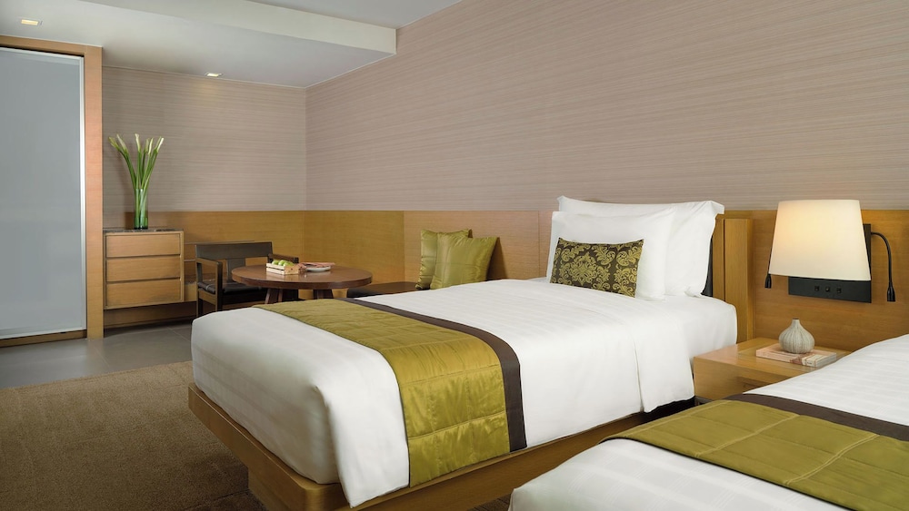 Premier Suite with Twin Bed del hotel Jc Kevin Sathorn Bangkok. Foto 1