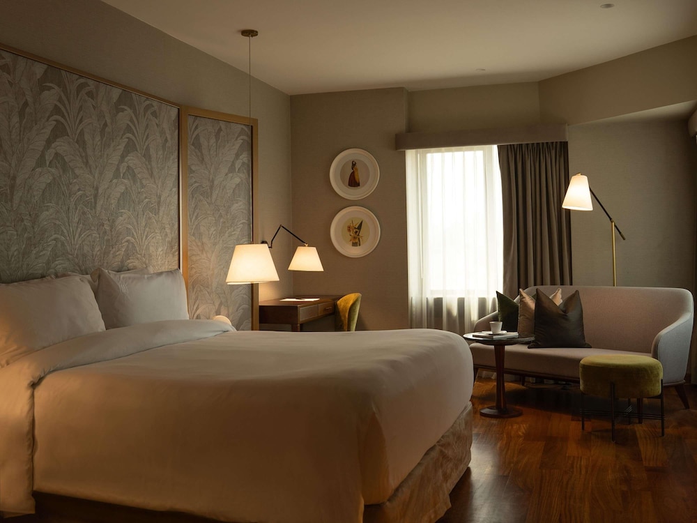 Habitación Deluxe con una cama King size del hotel Manto Lima – Mgallery