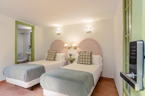 Habitación Doble - 1 o 2 camas del hotel La Abadia de Giralda. Foto 9